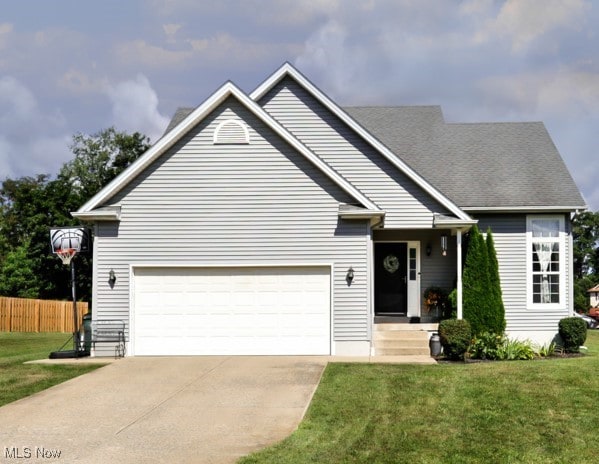 view of front of home featuring a garage and a front lawn