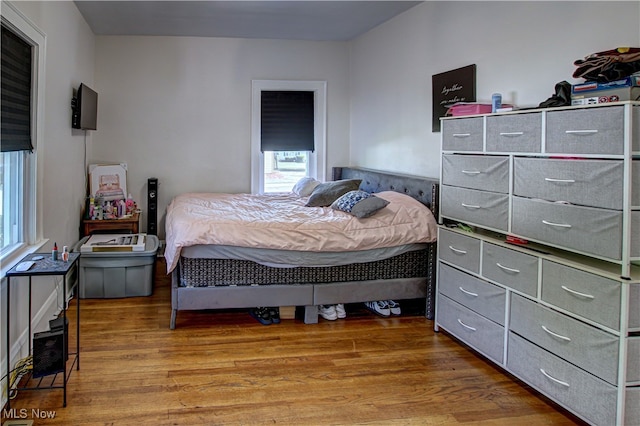 bedroom with light hardwood / wood-style floors