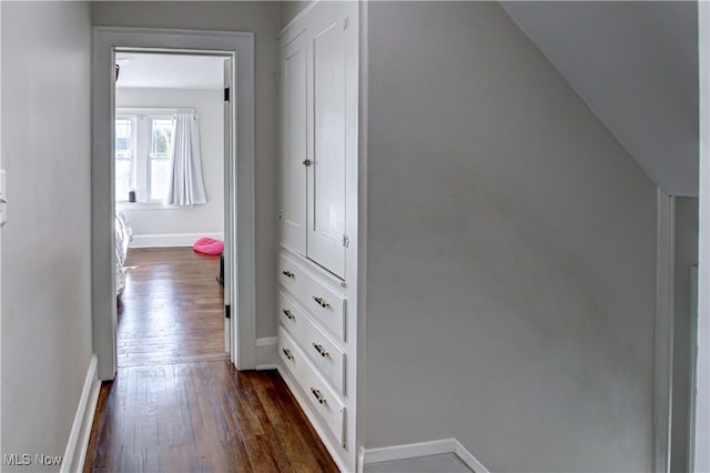 hallway featuring dark hardwood / wood-style flooring