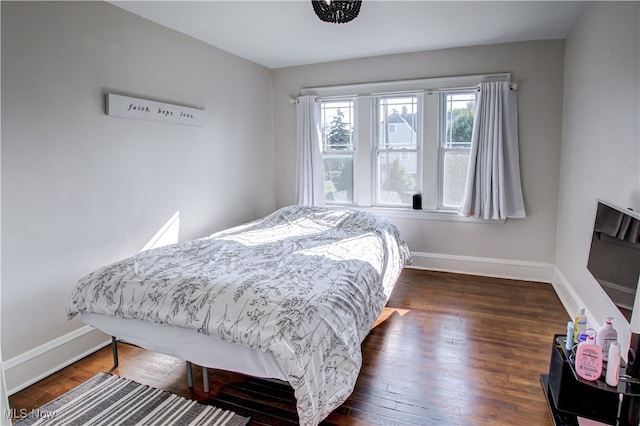 bedroom featuring dark hardwood / wood-style floors