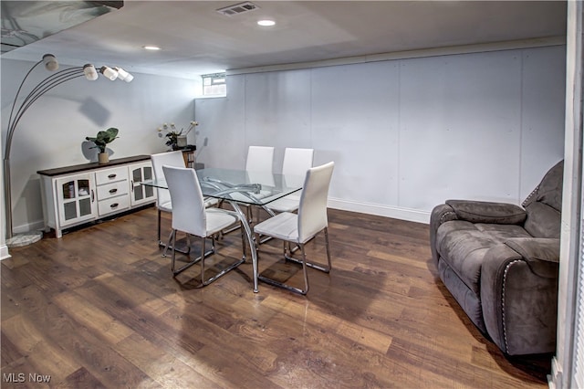 dining space featuring dark hardwood / wood-style flooring