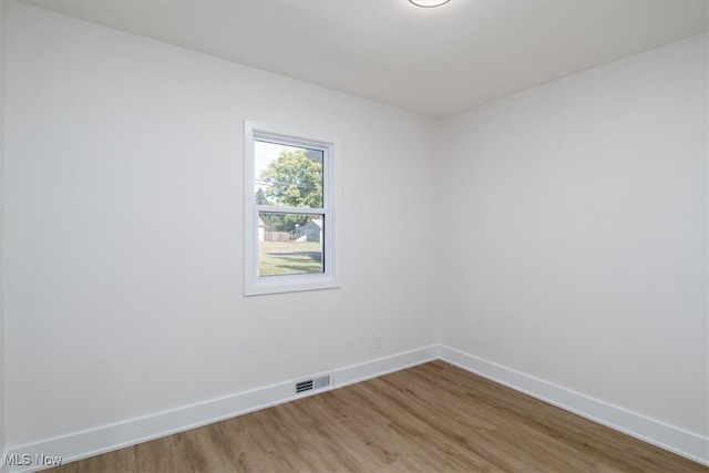 unfurnished room featuring wood-type flooring