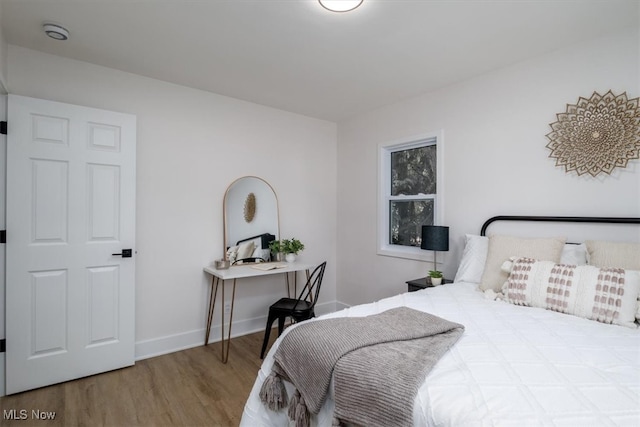 bedroom featuring hardwood / wood-style flooring