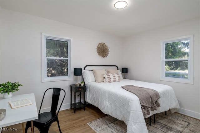 bedroom featuring wood-type flooring