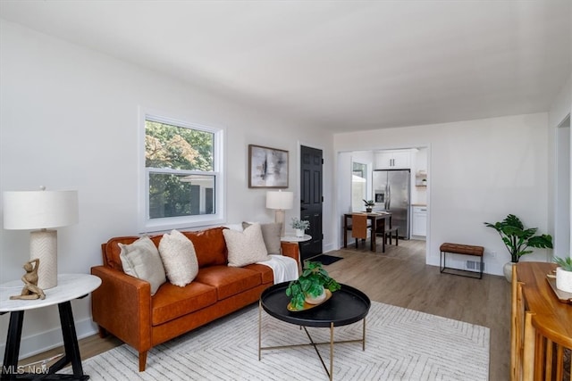 living room with light hardwood / wood-style floors