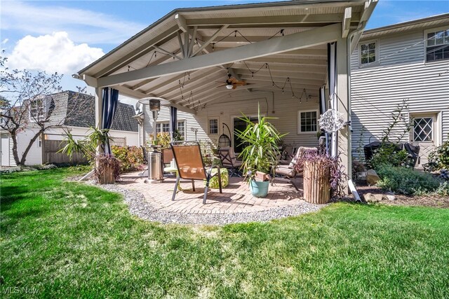 exterior space with ceiling fan and a patio area