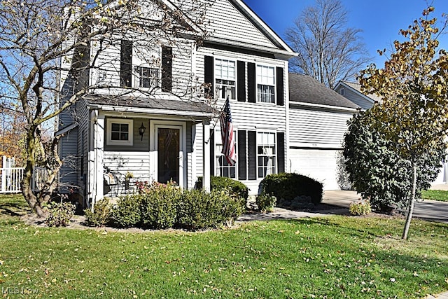 view of front facade featuring a front yard and a garage