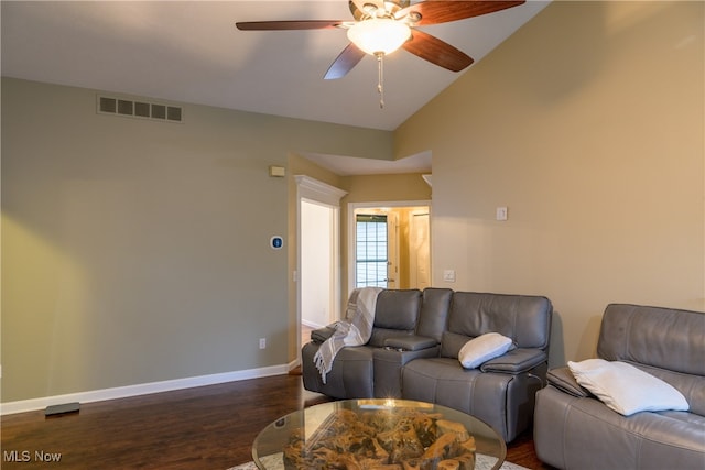 living room with lofted ceiling, ceiling fan, and dark hardwood / wood-style flooring