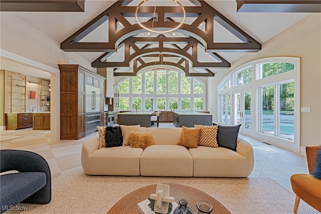 tiled living room featuring high vaulted ceiling and beamed ceiling