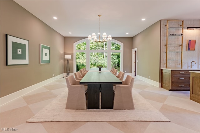 dining room featuring a notable chandelier and sink