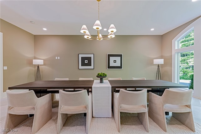 dining space featuring an inviting chandelier