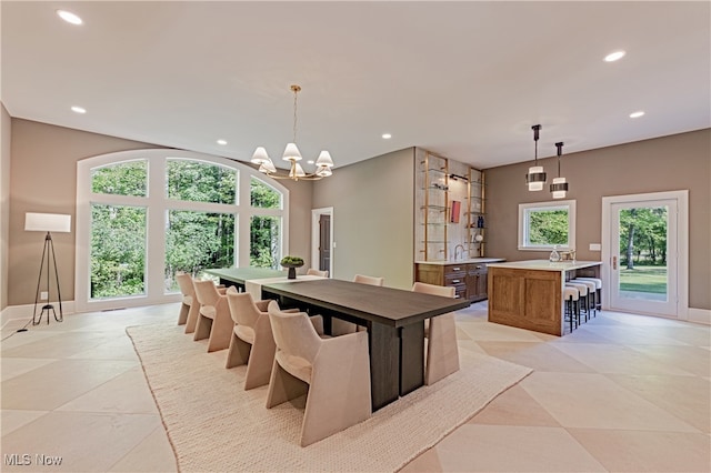 dining space with a chandelier