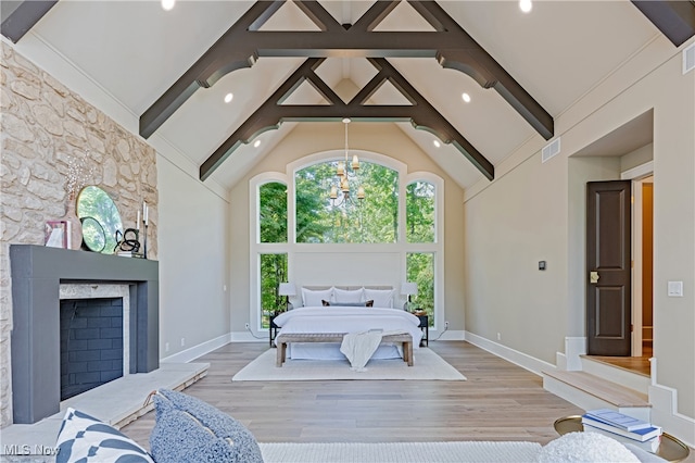 living room featuring high vaulted ceiling, beam ceiling, and a fireplace