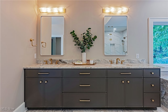 bathroom featuring a shower and vanity