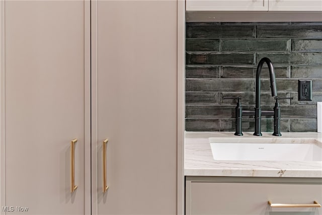 bathroom with backsplash and vanity