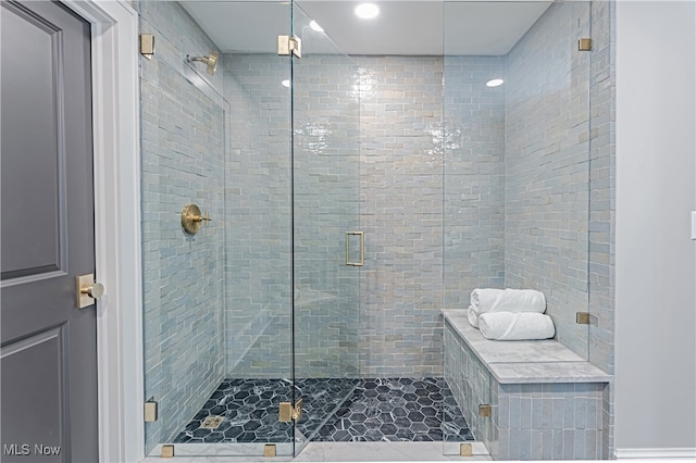 bathroom with an enclosed shower