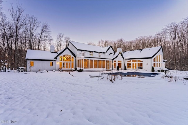 view of snow covered house