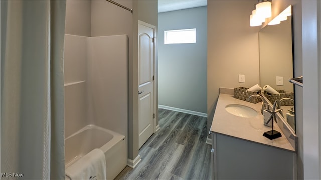 bathroom with hardwood / wood-style floors and vanity