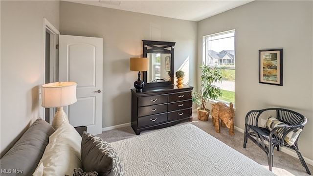 bedroom featuring light carpet