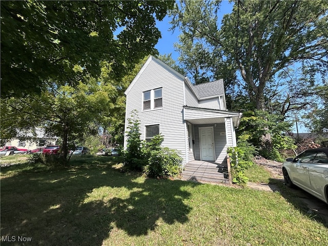 view of home's exterior with a lawn