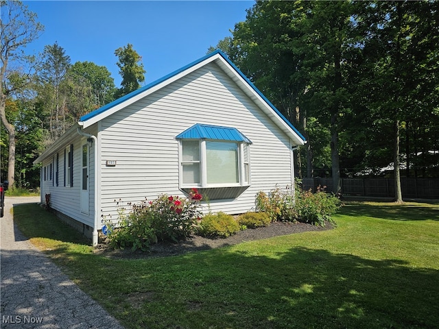 view of home's exterior featuring a lawn