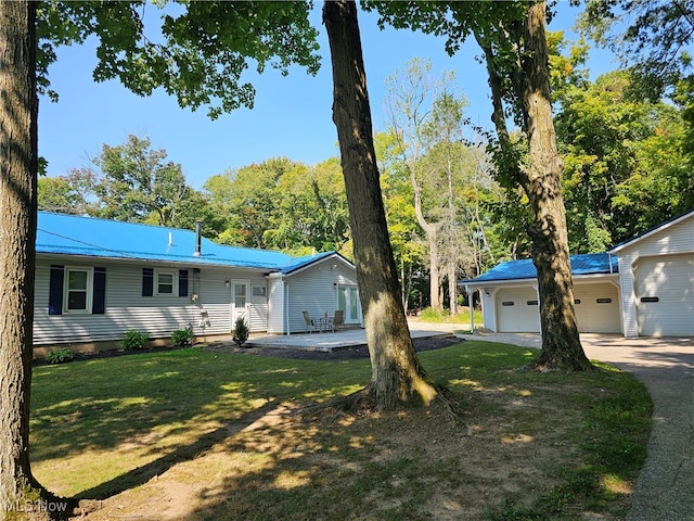 exterior space with a front lawn and a garage