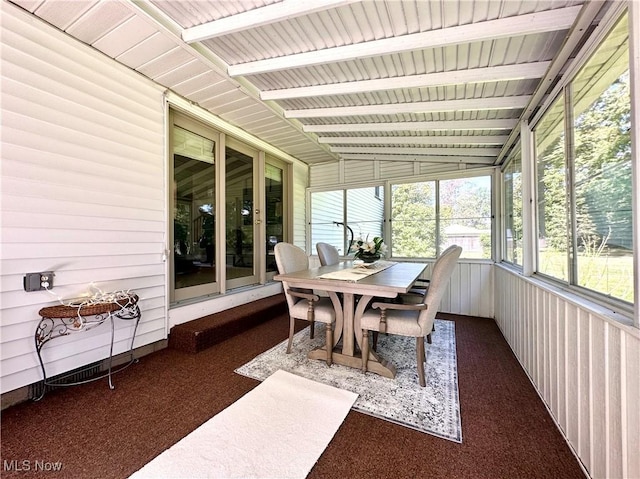 sunroom featuring lofted ceiling