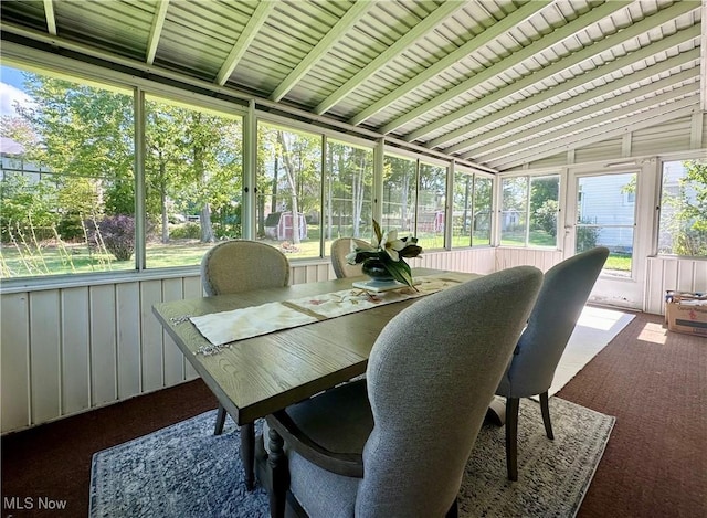 sunroom featuring lofted ceiling