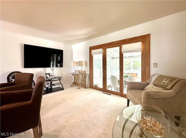 living room featuring carpet and french doors