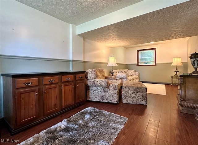 interior space featuring dark hardwood / wood-style floors and a textured ceiling