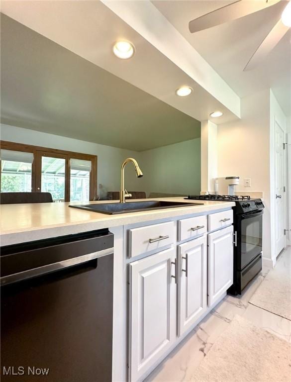 kitchen featuring white cabinetry, dishwasher, sink, black range with gas stovetop, and ceiling fan