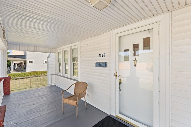 wooden terrace featuring a porch