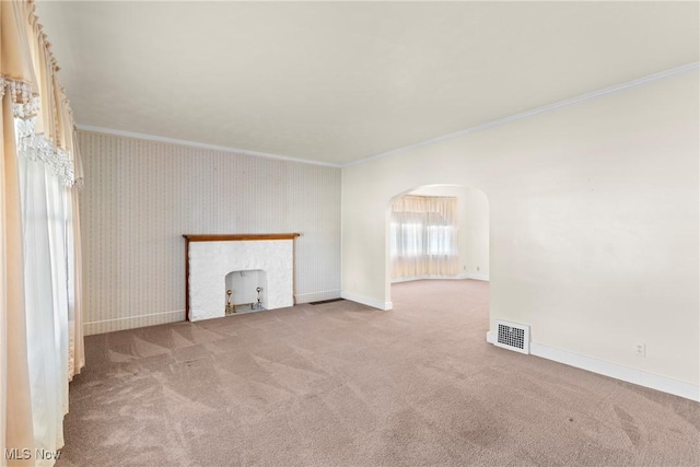 2110 Commerce St, Wellsburg, WV 26070 - unfurnished living room with visible vents, arched walkways, carpet flooring, and crown molding
