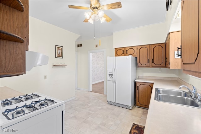 kitchen featuring ventilation hood, white appliances, ceiling fan, and sink