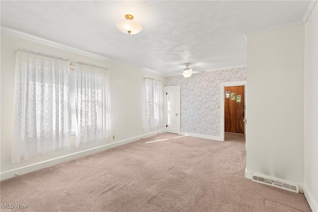 2110 Commerce St, Wellsburg, WV 26070 - carpeted empty room with visible vents, a ceiling fan, baseboards, and ornamental molding