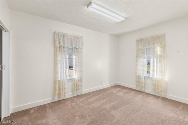 2110 Commerce St, Wellsburg, WV 26070 - carpeted spare room with baseboards and a healthy amount of sunlight