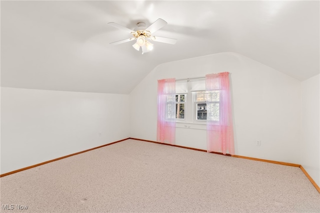 bonus room featuring ceiling fan, carpet floors, and vaulted ceiling