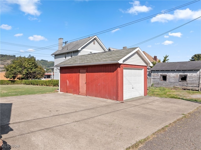 garage featuring a yard