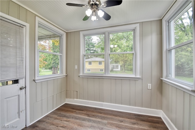 interior space featuring ceiling fan and a wealth of natural light