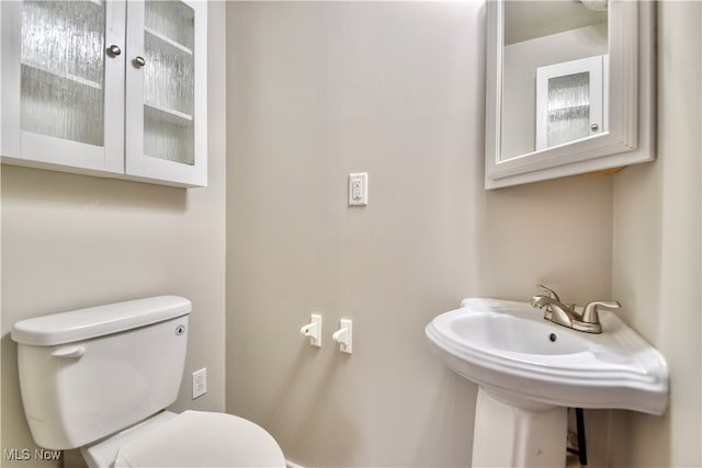 bathroom with toilet and sink