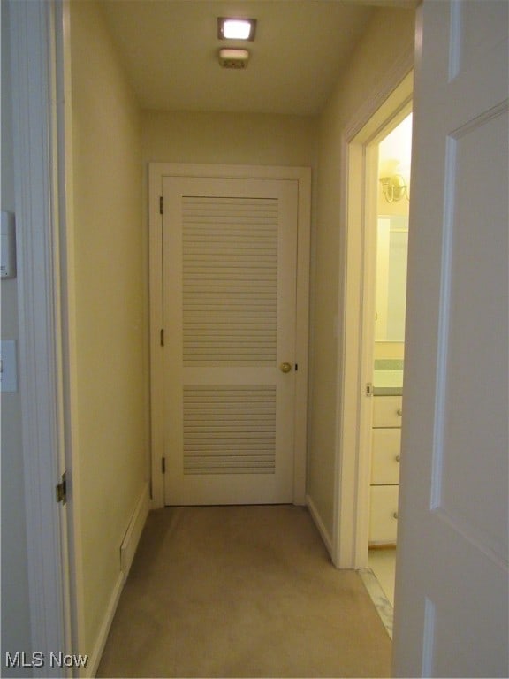 corridor with light colored carpet