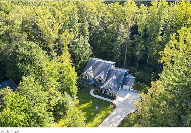 drone / aerial view with a view of trees