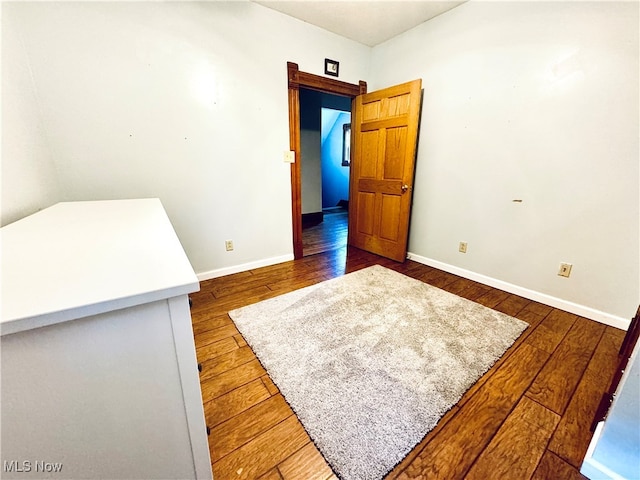 empty room featuring dark hardwood / wood-style floors