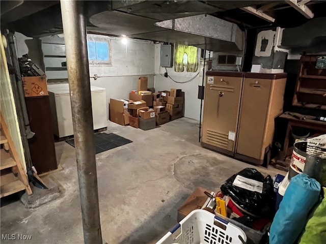 basement featuring washer / clothes dryer and electric panel