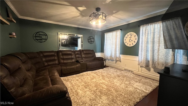 carpeted living room with ornamental molding