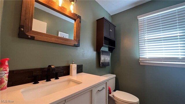 bathroom with vanity and toilet