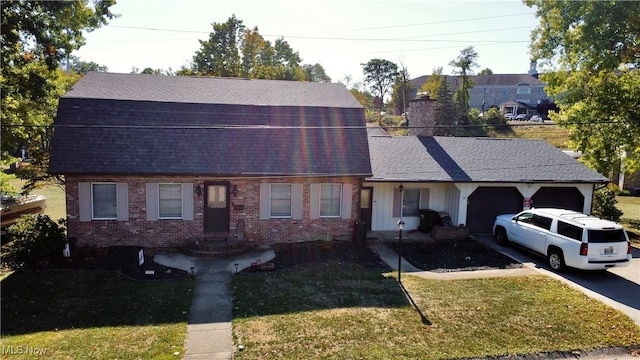 view of front of property with a front lawn and a garage