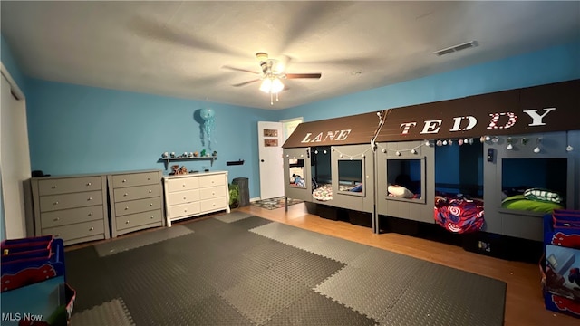 bedroom with ceiling fan and hardwood / wood-style floors