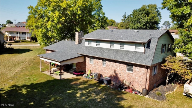 back of property featuring central AC, a lawn, and a patio