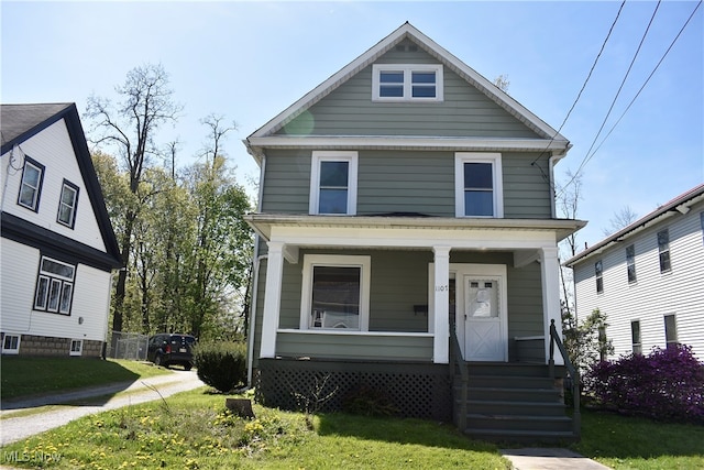 view of front of house with a front lawn and covered porch